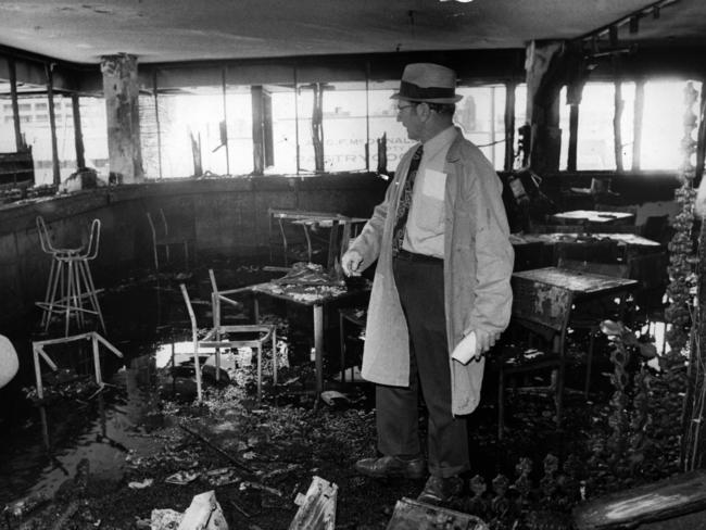 Inspector LJ Bardwell of CIB Scientific Section inspects the damage at the Whiskey Au-Go-Go nightclub in Brisbane on March 1973. Picture: News Ltd Photo File