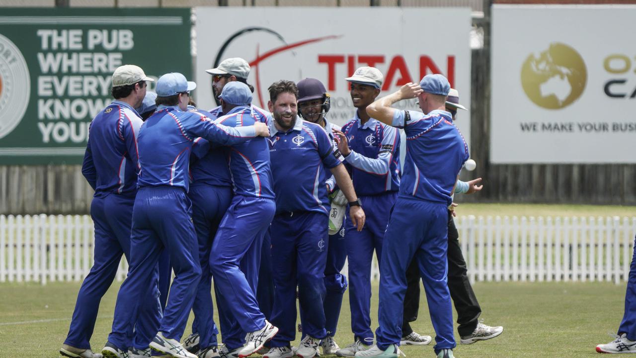 Dwayne Hooper and Ivanhoe teammates celebrate a wicket. Picture: Valeriu Campan