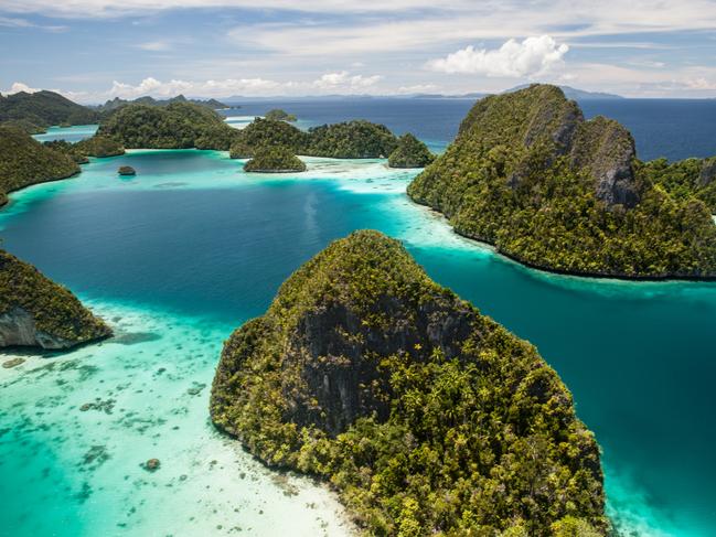 Limestone islands surround a remote, tropical lagoon in Wayag, Raja Ampat, Indonesia. This equatorial region is known for its beautiful reefs and high marine biodiversity.credit: istockescape30 may 2021kendall hill misool resort