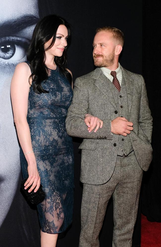 The couple flash a sneaky smile at each other while attending <i>The Girl on the Train </i>premiere this week.