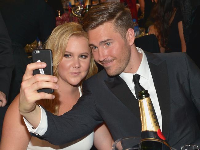 Schumer with boyfriend Ben Hanisch pose for a selfie photo at the 21st Annual Critics' Choice Awards in January. Picture: Getty