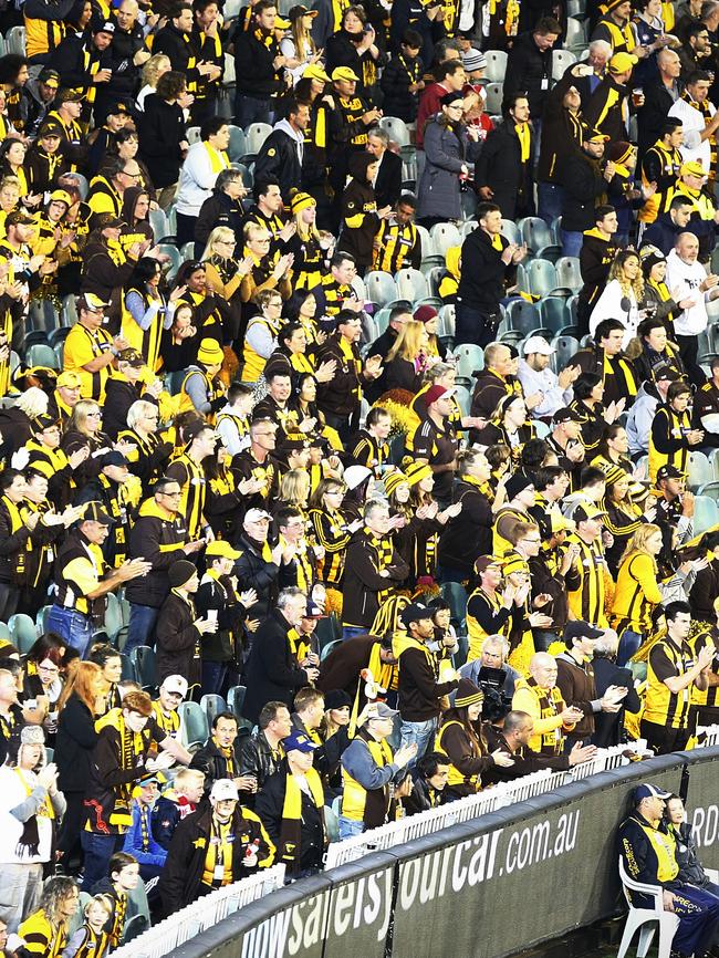 Hawthorn fans clap during the second minute of the second term as a tribute to Roughead. Picture: Wayne Ludbey