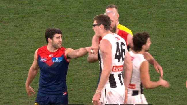 Mason Cox and Christian Petracca had words. Photo: Fox Footy.