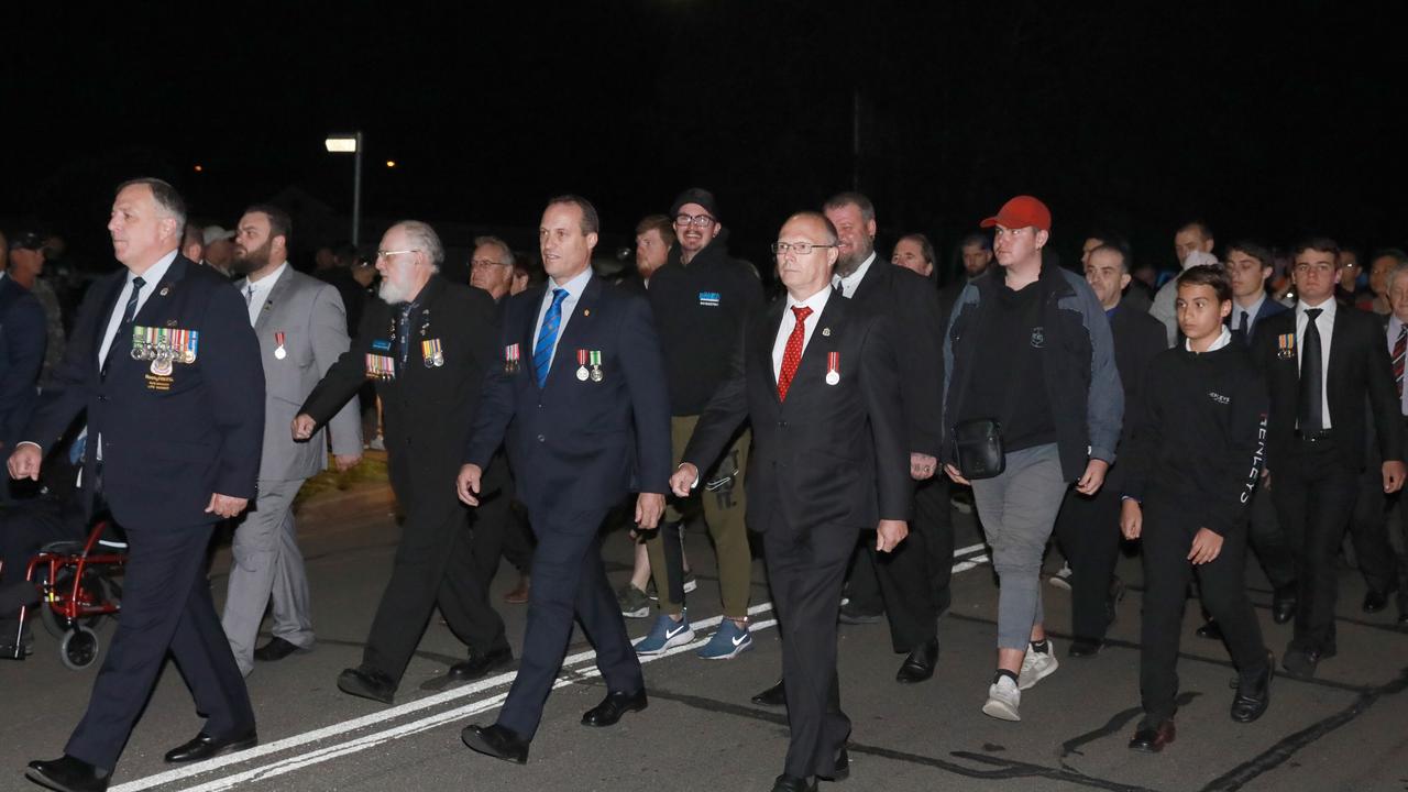 War veterans and descenants march towards Pinegrove Memorial Park in Minchinbury for the start of the Anzac day dawn service. Picture: Angelo Velardo