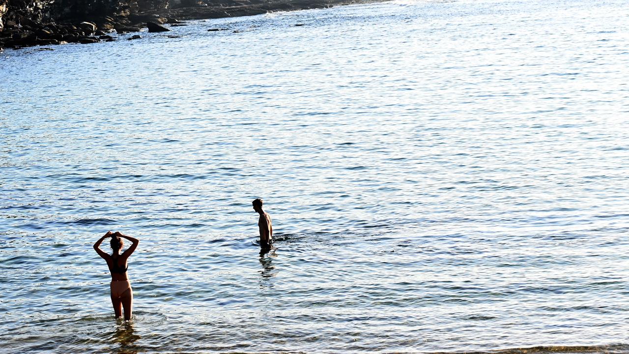 Two lone swimmers take to the water at Little Bay this morning. Picture: NCA NewsWire / Jeremy Piper