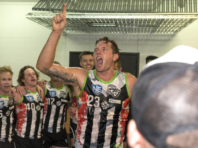 Jed Turner celebrating with his Southport teammates after the Sharks Round 21 NEAFL win over Sydney University at Fankhauser Reserve on Saturday, August 24, 2019. Picture credit: TJ Yelds/NEAFL.