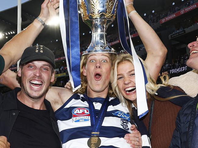 MELBOURNE, AUSTRALIA - SEPTEMBER 24: Sam De Koning of the Cats celebrates with family and friends after winning the 2022 AFL Grand Final match between the Geelong Cats and the Sydney Swans at the Melbourne Cricket Ground on September 24, 2022 in Melbourne, Australia. (Photo by Daniel Pockett/AFL Photos/via Getty Images)