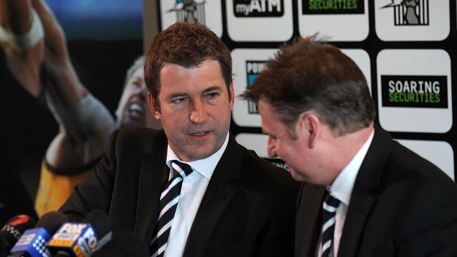 Mark Haysman, left, in 2011 as he announced his resignation at Port Adelaide Football Club shaking the hand of president Brett Duncanson.