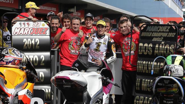 Marquez celebrates with his crew, his dad and his brother.