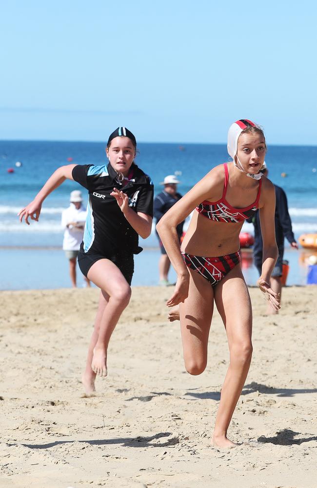 Competitors in the u/15 womens beach flags event. Tasmanian Surf Lifesaving Championships at Clifton Beach. Picture: NIKKI DAVIS-JONES