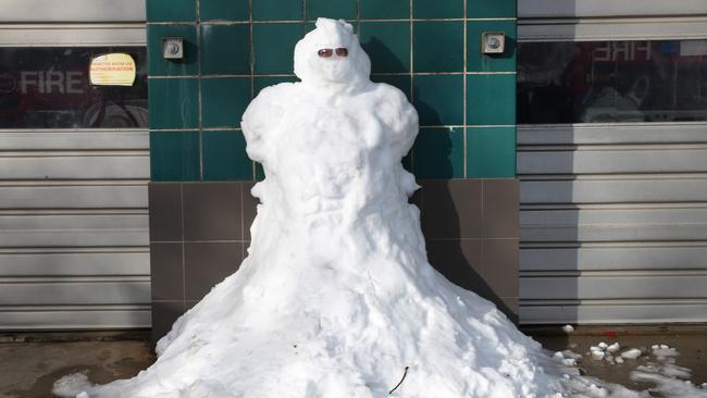 Heavy snow fell overnight in the Upper Blue Mountains town of Blackheath. A snowman guards the fire station.