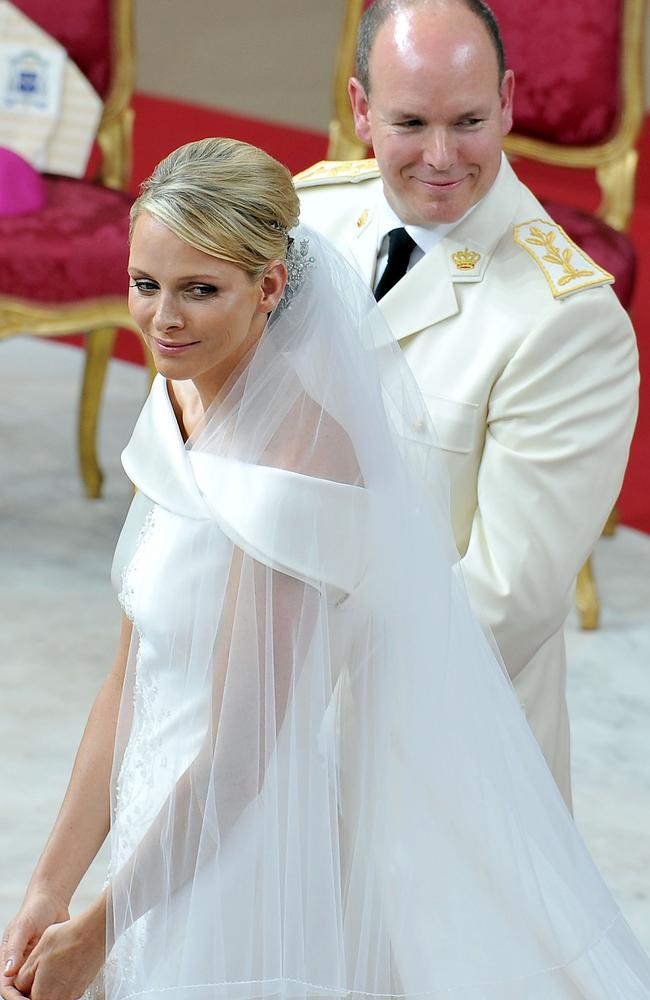 Princess Charlene of Monaco and Prince Albert Of Monaco smile during their wedding in 2011. Picture: Getty Images