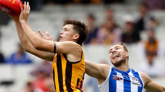 Mitch Lewis marks in front of Ben McKay before the Kangaroos defender was subbed off with concussion. Picture: AFL Photos via Getty Images