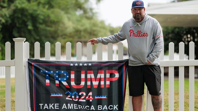 Electrical engineer Tim Lennon, 49, stands near his Trump sign in Montgomery County in southeastern Pennsylvania. Picture: Hannah Beier