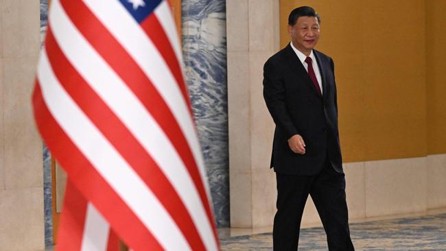 China's President Xi Jinping walks as he meets US President on the sidelines of the G20 Summit in Nusa Dua on the Indonesian resort island of Bali on November 14, 2022. (Photo by SAUL LOEB / AFP)