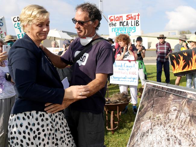 Independent MP Zali Steggall hugs bushfire survivor Nick Hopkins of Malua Bay with debris from his house at Parliament House on February 11, 2020 in Canberra, Australia. Picture: Tracey Nearmy.