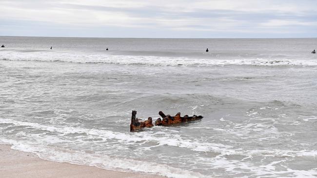 Cyclone Alfred has eroded the sands at Dicky Beach to reveal the remanence of the vessel SS Dicky. Picture: Patrick Woods.