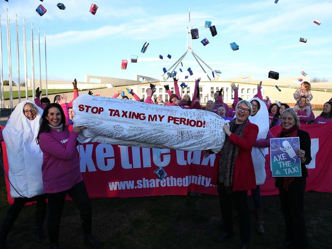 Activists call for the government to axe the tampon tax on the lawns of Parliament House in Canberra with Greens Senator Janet Rice and Lee Rhiannon (front right) before the bill is debated today. Picture: Kym Smith