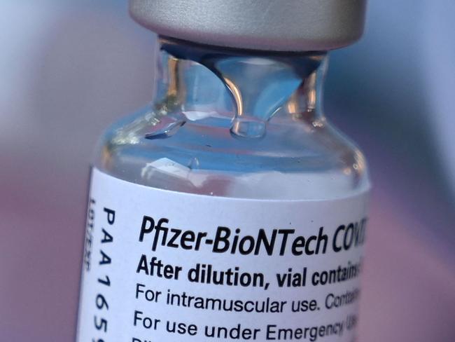 A vial of Pfizer-BioNTech Covid-19 vaccine is seen at a pop up vaccine clinic in the Arleta neighborhood of Los Angeles, California, August 23, 2021. - The US Food and Drug Administration on August 23, fully approved the Pfizer-BioNTech Covid shot, triggering a new wave of vaccine mandates as the Delta variant batters the country. Around 52 percent of the American population is fully vaccinated, but health authorities have hit a wall of vaccine hesitant people, impeding the national campaign. (Photo by Robyn Beck / AFP)