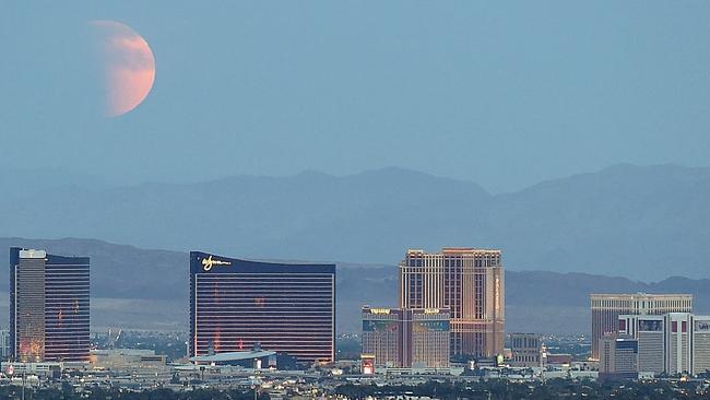 An eclipsed supermoon rises behind the Las Vegas Strip in September 2015 in Las Vegas, Nevada. Picture: Ethan Miller/Getty Images.