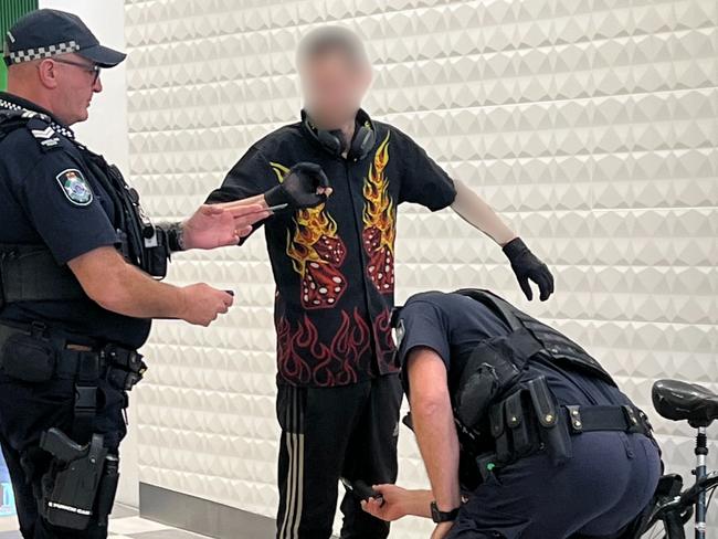 Police conducting wanding operations at Australia Fair in Southport. The man pictured was not found to be carrying any items of concern. Picture: Keith Woods.