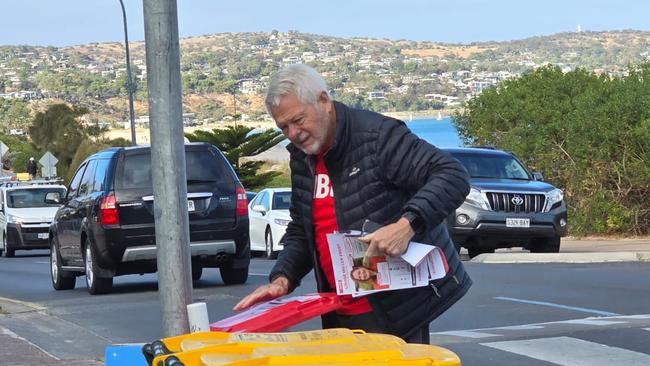 Video has emerged of a Labor volunteer ripping down an election poster at a Boothby polling booth.