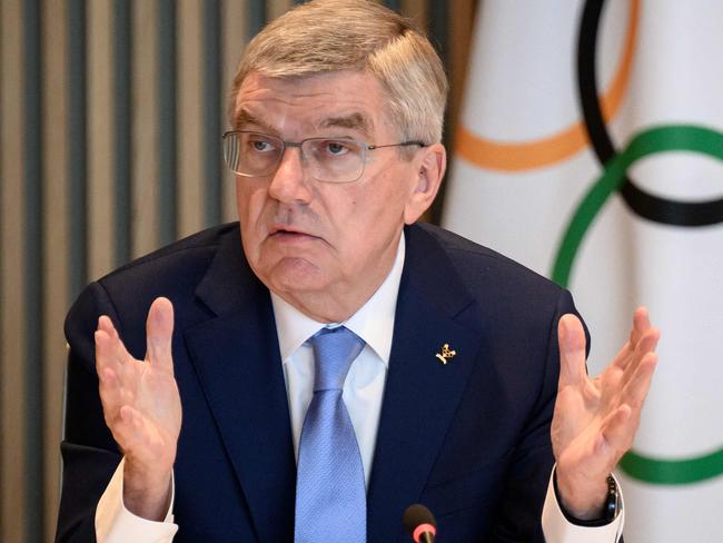 International Olympic Committee (IOC) President Thomas Bach gestures during an IOC executive board meeting where the issue of Russian athletes will be discussed, in Lausanne, on March 28, 2023. - Poland, Ukraine and the Baltic states reiterated on March 27, 2023 their call to maintain the ban on Russian and Belarusian athletes at the Olympics, saying "not a single reason" existed to lift the restrictions. (Photo by Fabrice COFFRINI / AFP)