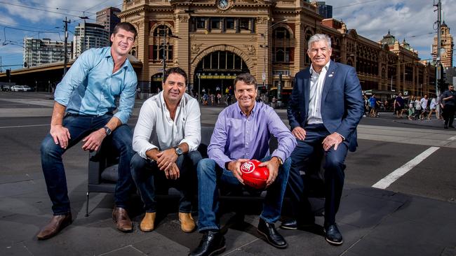 On The Couch panel members Jonathan Brown, Garry Lyon, Paul Roos and Gerard Healy sitting outside Flinders Street Station. Picture: Tim Carrafa