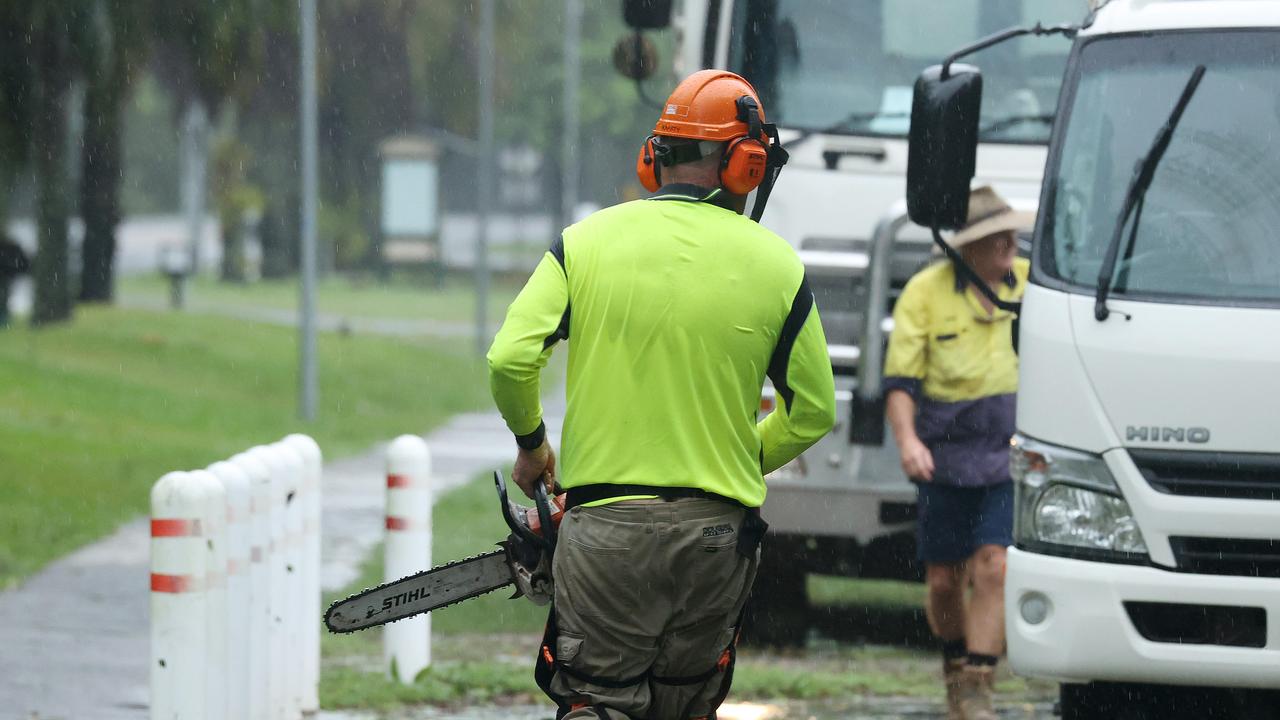 Tree lopping is under way in Port Douglas as part of cyclone clean-up. Picture: Liam Kidston