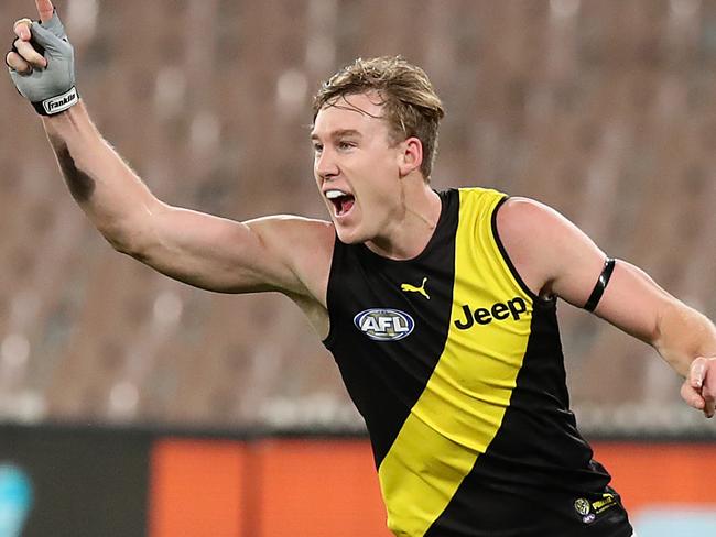 MELBOURNE, AUSTRALIA - JULY 05: Tom J. Lynch of the Tigers celebrates kicking a goal during the round 5 AFL match between the Melbourne Demons and the Richmond Tigers at Melbourne Cricket Ground on July 05, 2020 in Melbourne, Australia. (Photo by Graham Denholm/AFL Photos via Getty Images)