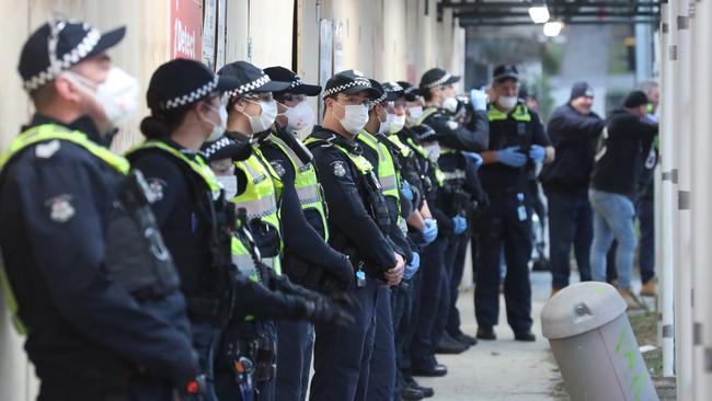 Police keep an eye on the scene on Wednesday morning. Picture: David Crosling