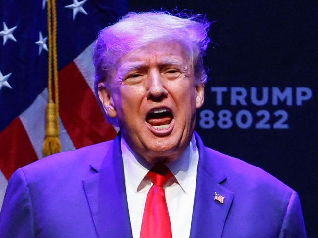 (FILES) In this file photo taken on March 13, 2023, former US President Donald Trump arrives for an event at the Adler Theatre in Davenport, Iowa. - Senior Republicans on March 19, 2023, echoed Donald Trump's claim that a looming indictment in a hush-money case would amount to political "persecution," while Democrats warned his call for protests could trigger a repeat of chaos his supporters unleashed at the US Capitol. (Photo by KAMIL KRZACZYNSKI / AFP)