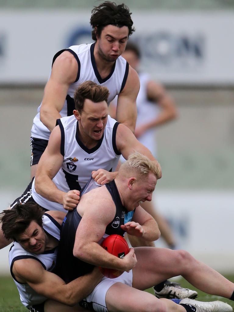 Vic Country’s Nikolaus Rokahr and Kayne Pettifer and VAFA’s Josh Green at Ikon Park, Carlton. Picture: Yuri Kouzmin