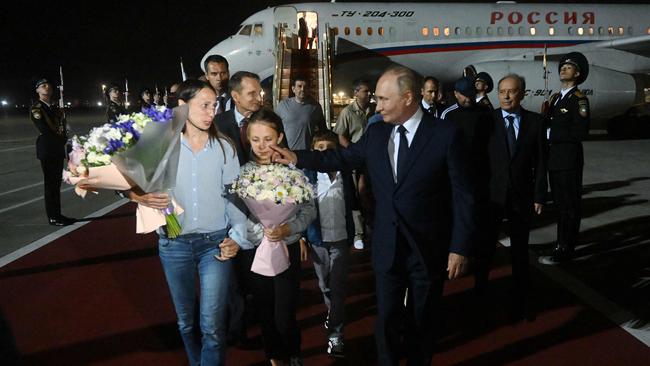 Sofia held her mother’s as they walked the red carpet with Putin. Picture: Mikhail Voskresenskiy/POOL/AFP