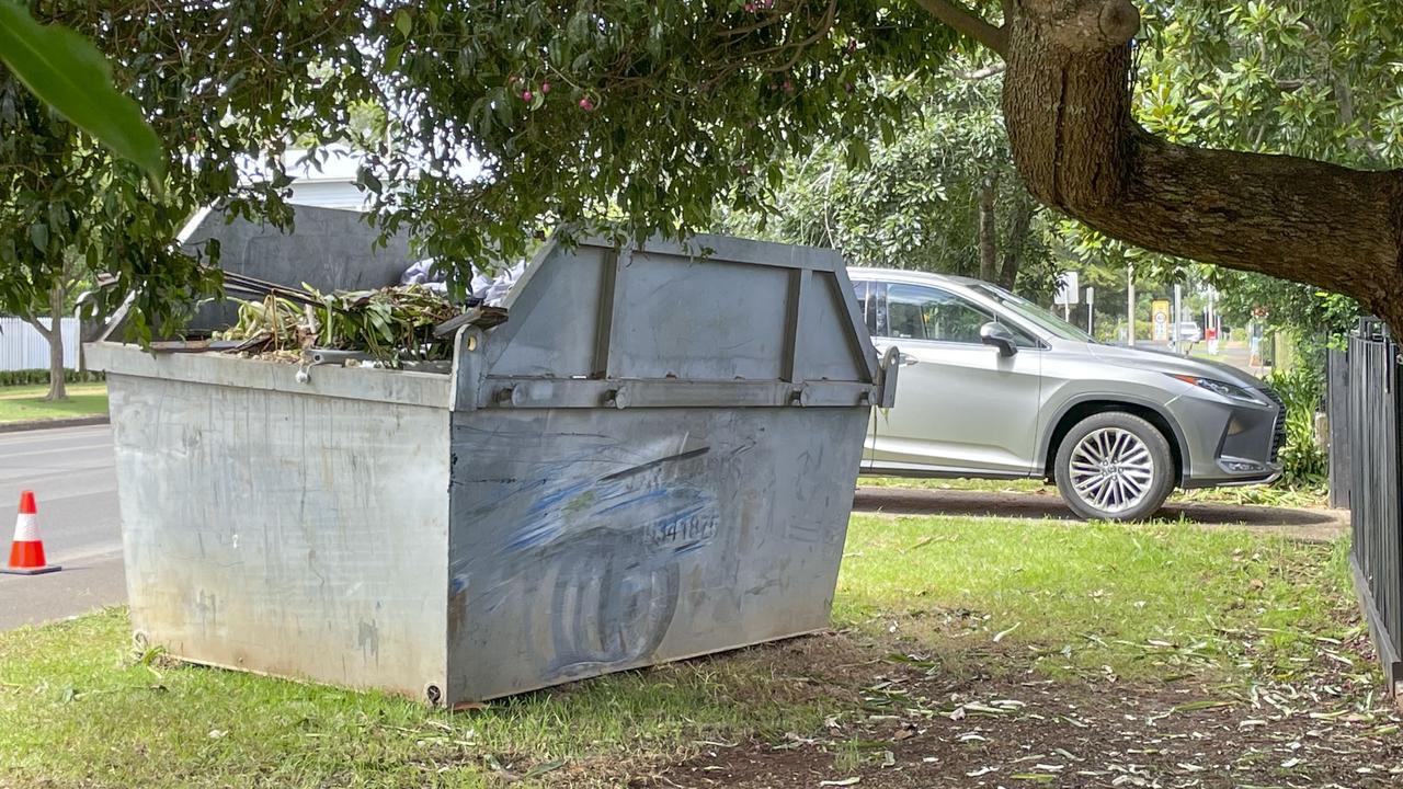 Scene of car crash in Mackenzie St in East Toowoomba. After hitting a tree the Ford sedan then hit a skip. Saturday, March 25, 2023. Picture: Nev Madsen.