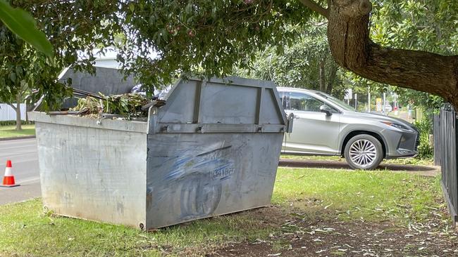 Scene of car crash in Mackenzie St in East Toowoomba. After hitting a tree the Ford sedan then hit a skip. Saturday, March 25, 2023. Picture: Nev Madsen.