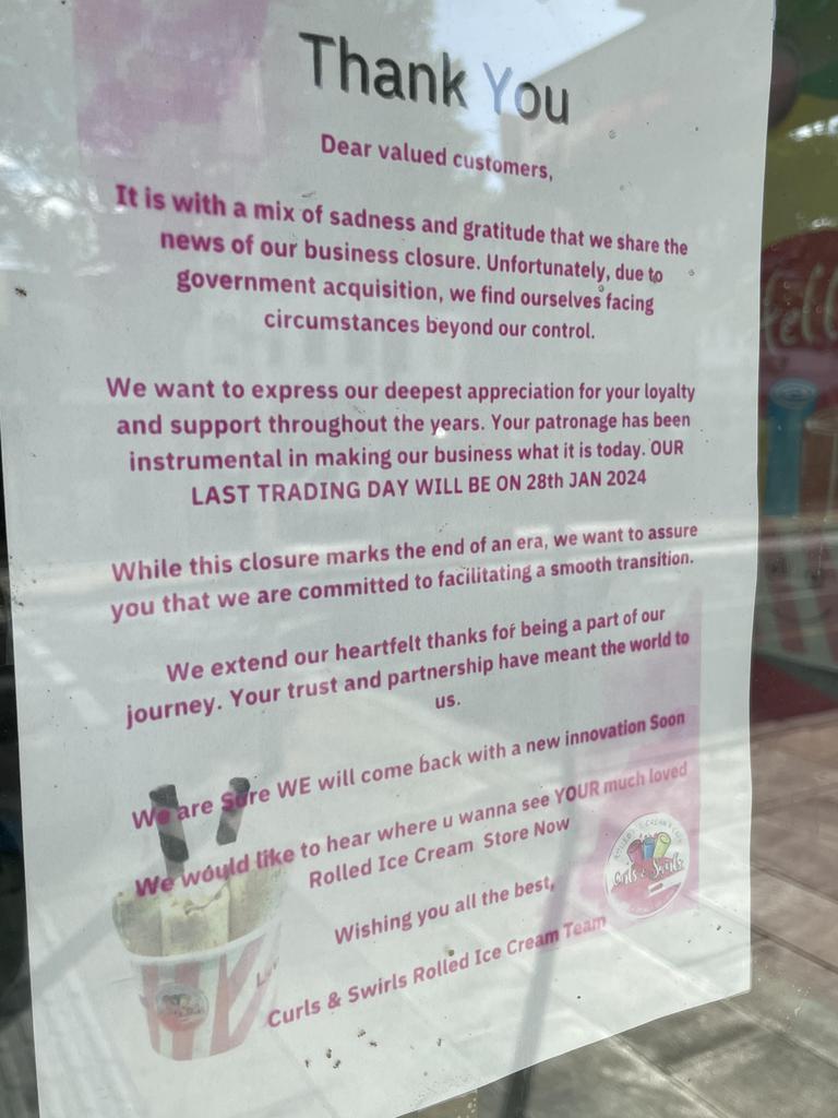 This sign remains in the front window of Curls & Swirls' former Ryrie St premises.