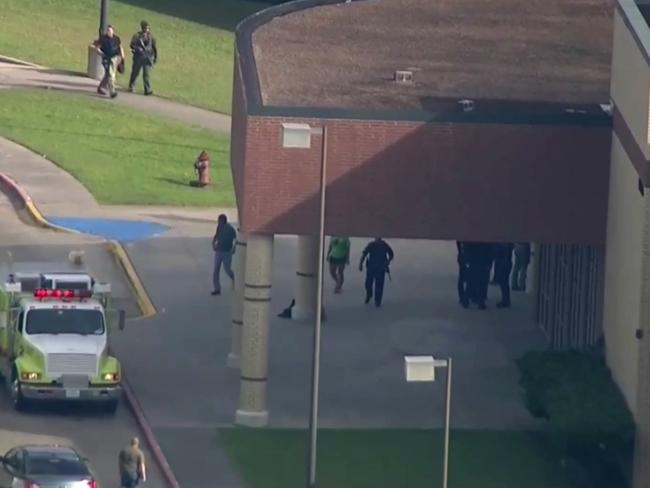 Law enforcement officers arrive at the school after reports of a gunman opening fire on students. Picture: KTRK-TV ABC13 via AP