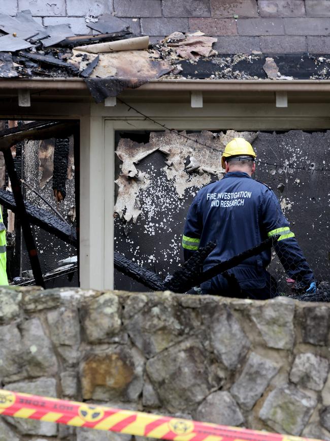 Firies investigated the ruins. Picture: Damian Shaw