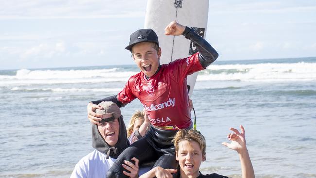 Max McGillivray of Evans Head is carried from the water after winning the under 14 boys title at the 2022 Oz Grom at Lennox.