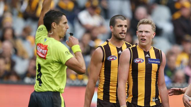 Hawthorn’s James Sicily looks at umpire Justin Power after a free kick was paid to Bulldogs forward Josh Schache. Picture: Michael Klein