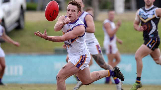 WRFL: Altona’s Jack Norman fires off a handball. Picture: George Salpigtidis