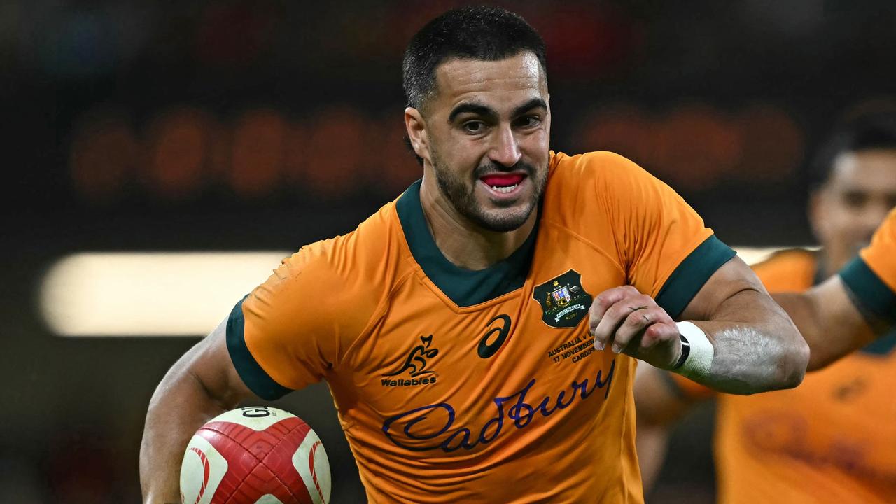 Australia's fullback Tom Wright scored a hat-trick. (Photo by Paul ELLIS / AFP)