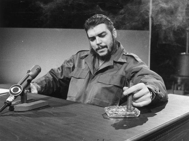 13 DECEMBER 1964 - Cuban industry minister Ernesto "Che" Guevara smokers cigar during interviews with United States' CBS network. PUBLISHED: 17/6/2001, pg 84.  p/l