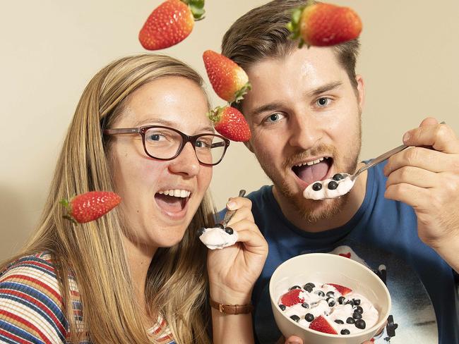 Jane Tyquin and Josh Dennis tuck into a fresh-food snack. Picture: Ellen Smith