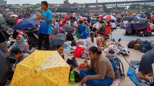 Crowds at the Opera House get ready for the New Year’s Eve celebrations. Picture: Monique Harmer