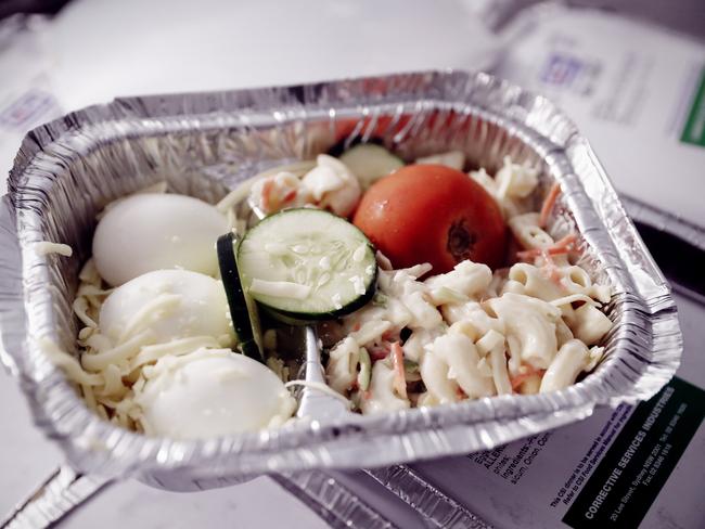 Egg and cheese salad in a foil tray plus a Christmas muffin is on the dinner menu in NSW prisons on December 25. Picture: Sam Ruttyn.