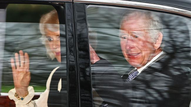 King Charles III and Britain's Queen Camilla wave as they leave Clarence House. Picture: AFP.