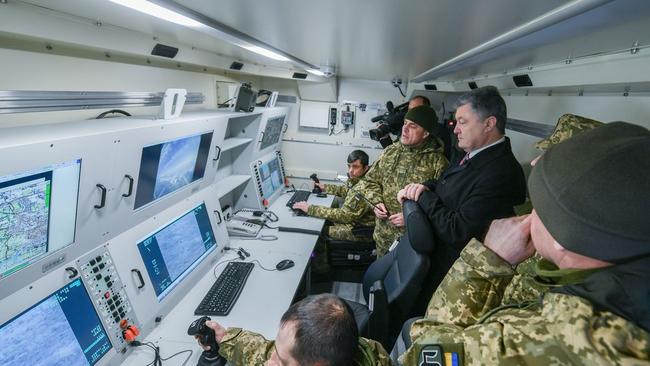 Former Ukraine President Petro Poroshenko watches a test flight of the Bayraktar TB2 drone in March 2019.