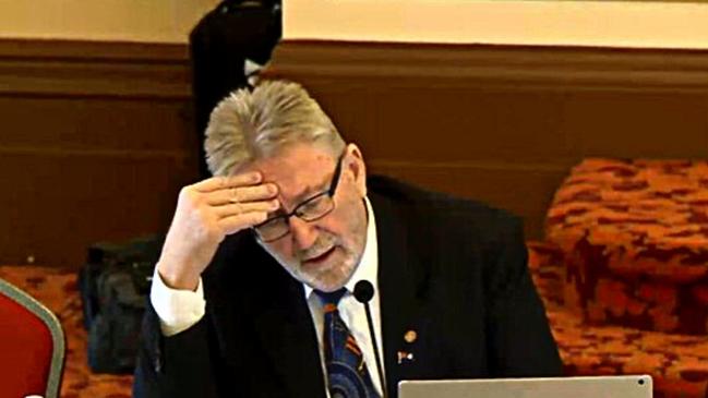 PCCC member Michael Crandon reviews questions to ask Alan MacSporran on Day 8 of the inquiry into the charging of eight Logan City councillors.